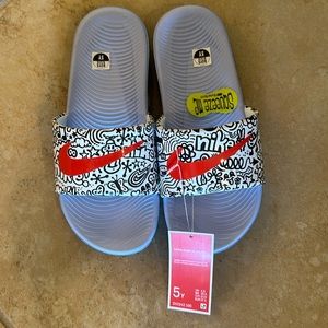 Brand new Nike slides. Boys size 5Y.